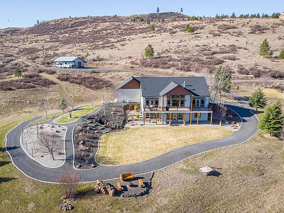 Fire wise landscaping, waterfall, professionally maintained lawn and fruit trees