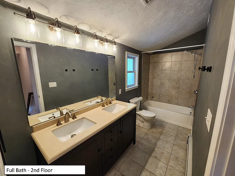 Full bath, double vanity, top of 2nd floor between 2nd and 3rd bedrooms.