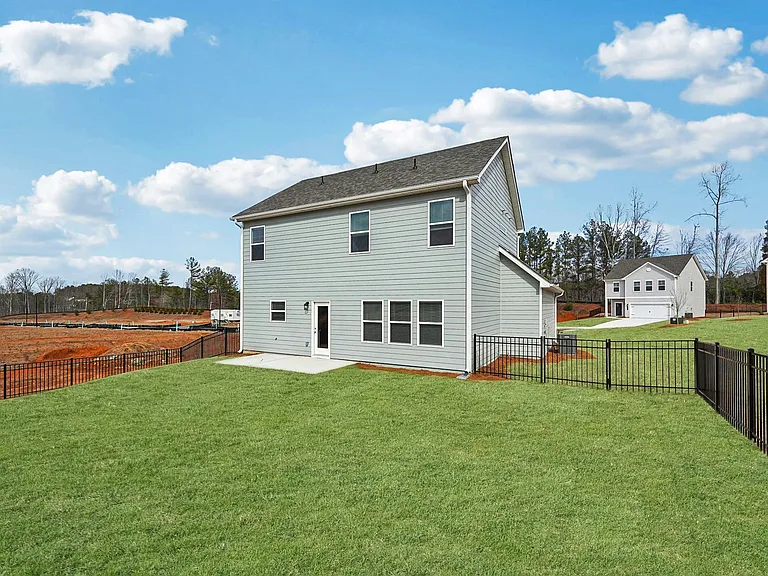 The back exterior of the Alexander floor plan's patio and fenced-in yard.