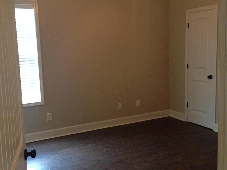 Bedroom with solid surface flooring. No carpet in house.