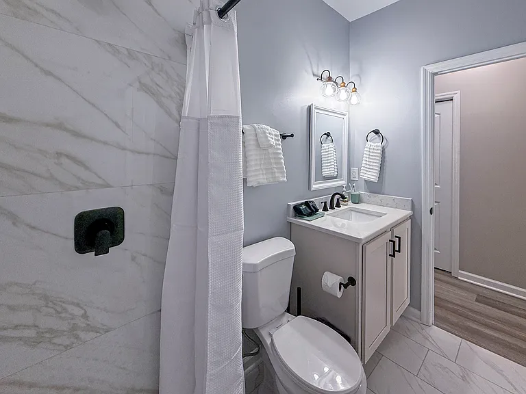 Downstairs full bathroom with walk-in marble shower