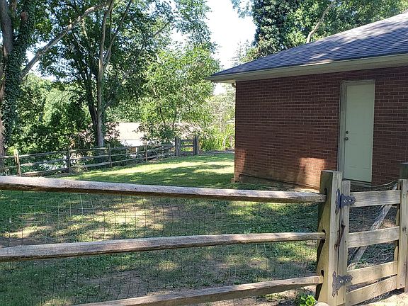 west side of house w/ door into garage