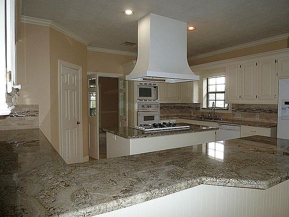 Recent updated granite counter tops, plus many cabinets.  Custom built with pull out shelves, this is a true Chefs kitche