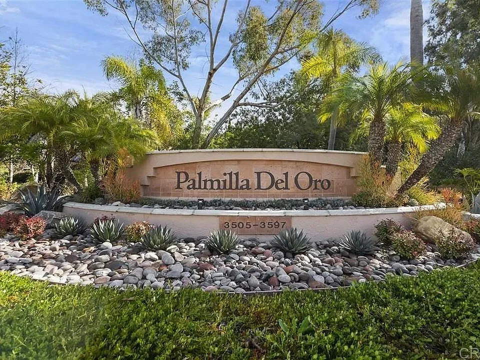 Nestled securely within a gated community, this home sits high up on the hill to capture refreshing breezes and premium privacy.