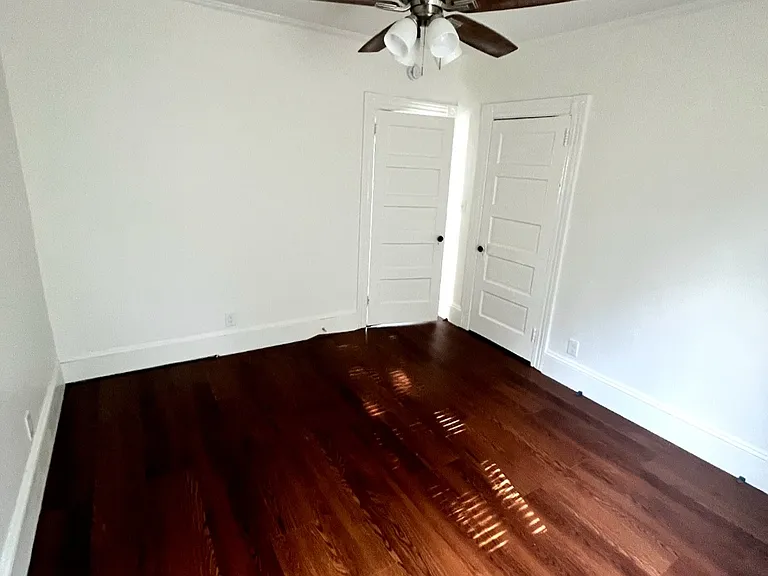 bedroom - new floors, paint and ceiling fan.