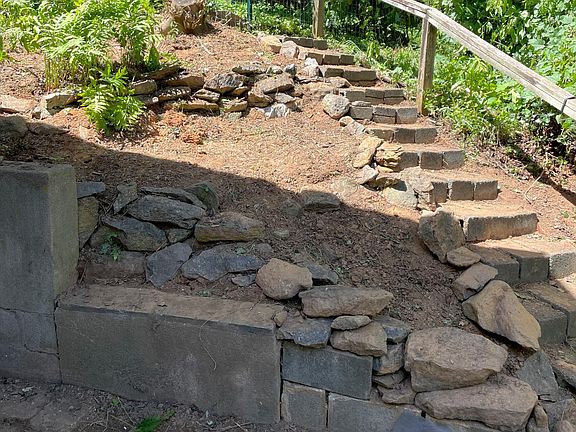 This is the hillside above the patio. I'm planting herbs and more ferns and mulching. The foreground will be paved for a small courtyard by the front door.