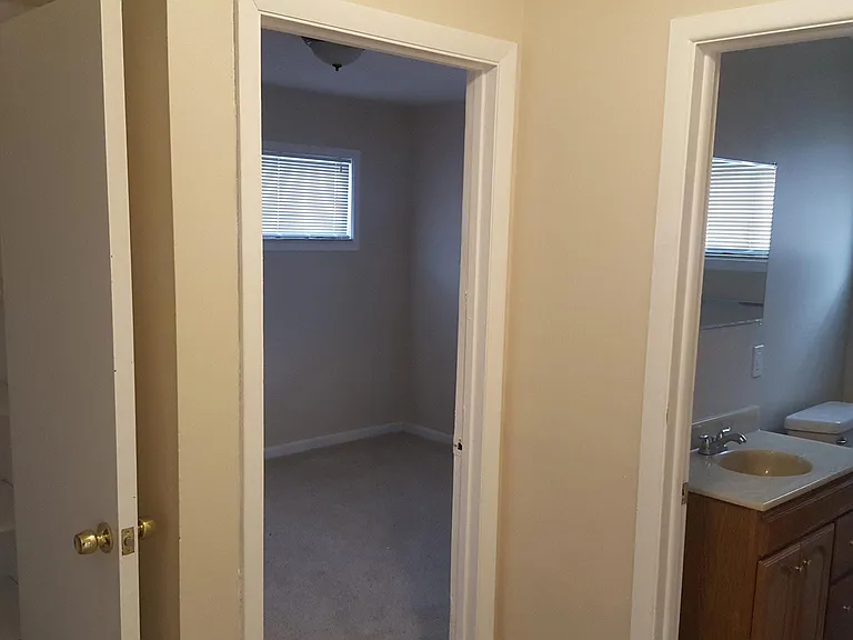 Hallway linen closet and main bathroom