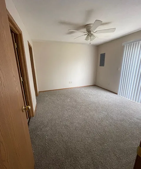 Primary bedroom with sliding door to patio and private bathroom