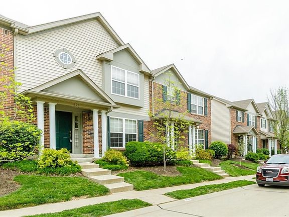 Outside of the property. Stairs lead to the townhouse.