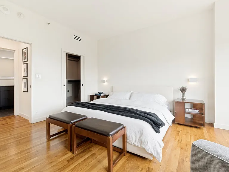 The bedroom is ensuite with walk-in closet and bath. The closet design is by California Closets. Note the convenient wall safe.