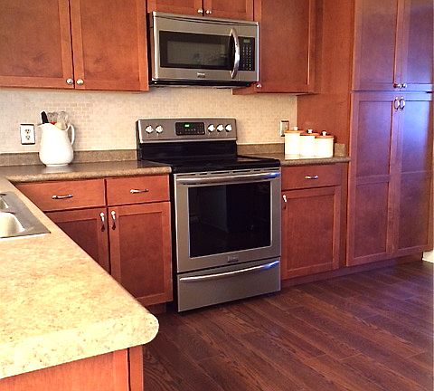 Kitchen w/ stove & microwave