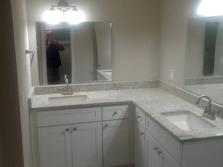 Master bathroom completely remodeled with tile flooring, double vanity