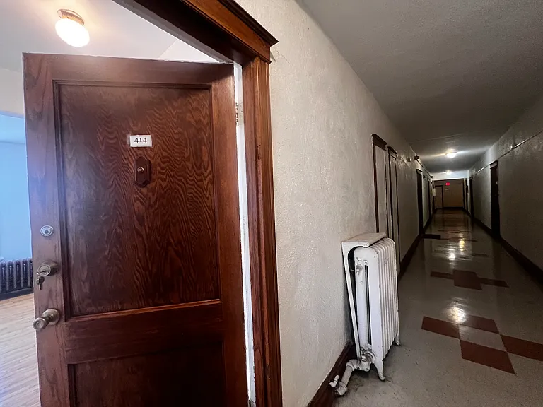 Looking from apartment down hallway.