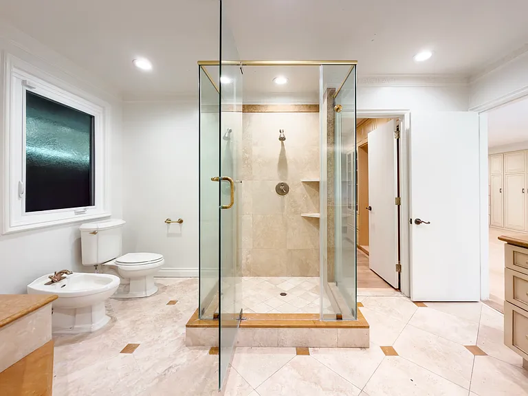 Frameless glass shower and a bidet add upscale convenience to this Beverly Hills luxury rental bathroom at 1094 Garden Lane, a 90210 home for rent.