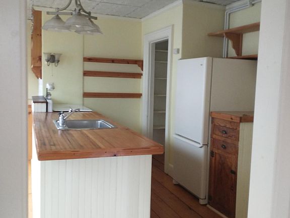 Open kitchen floor plan with center island.