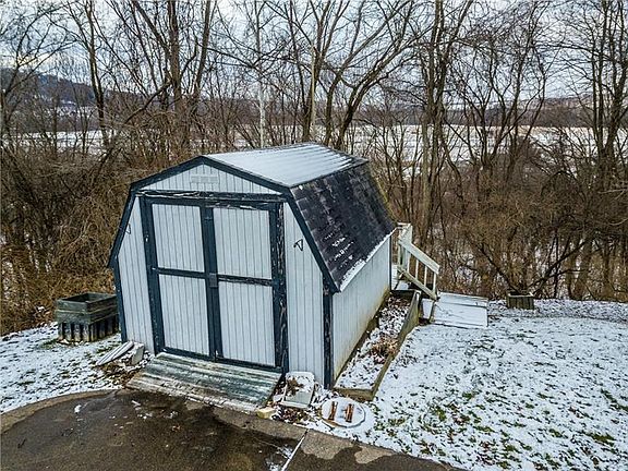 The storage shed is included and a great place to store all of your garden tools and lawn mowers. There is a small deck off the 