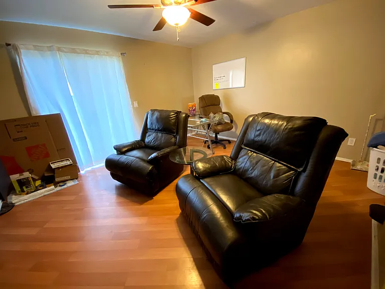 Living room area with private balcony access. Washer and dryer unit is located in a closet on the balcony. Balcony has a nice view of the complex's landscape.
Furniture here is not included.