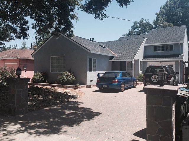 Front of house. Shared studio 17B on top of garage with side gated entrance.