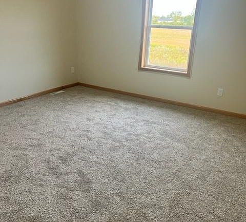 spacious bedroom with walk in closet.