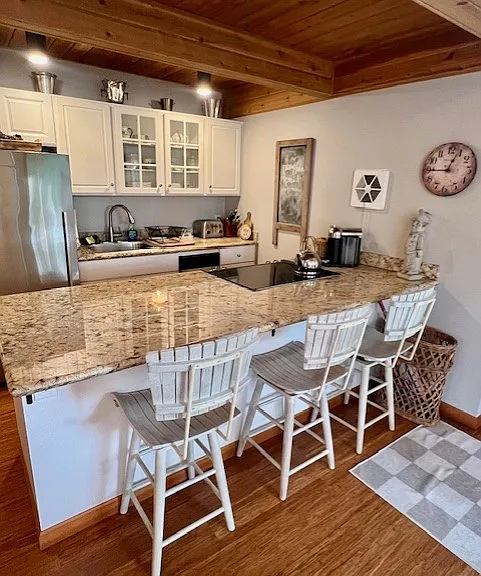Another view of kitchen and breakfast bar. Notice coffee maker, toaster etc. (Microwave in pantry)