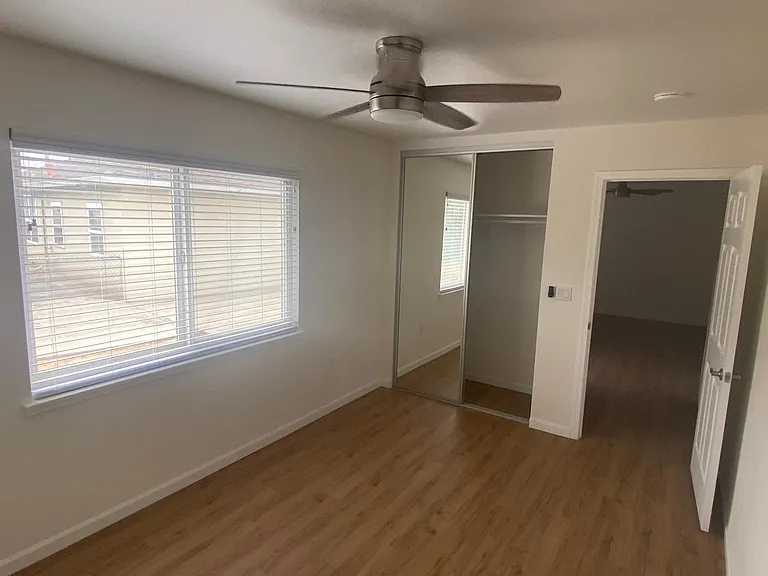 Bedroom#1 with sliding/mirror closet doors and new blinds.