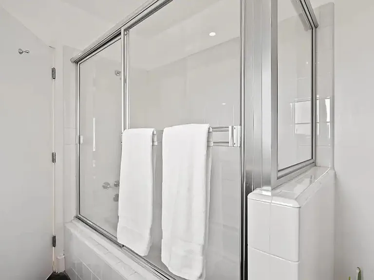 The ensuite bathroom offers both a shower and tub in one, providing options for your bathing preferences.