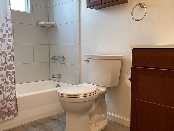 Kitchen with new floors, tile & toilet