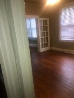 Beautiful wood floor throughout living and dining room entry way.