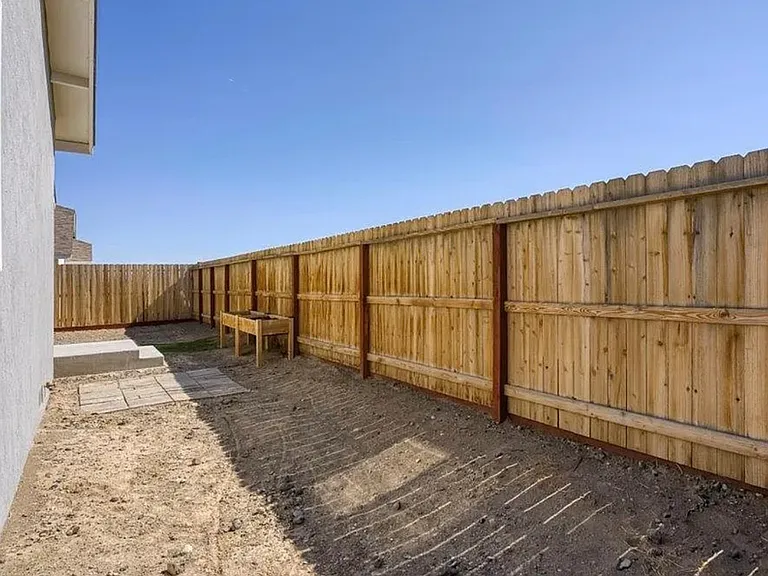 Back yard fully fenced and gated. Graveled