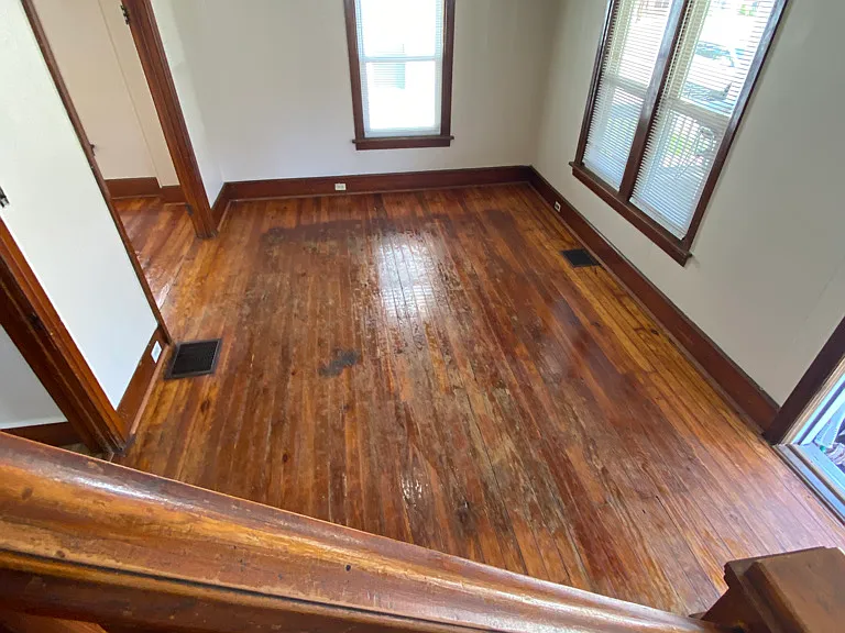 View of the living room while climbing the stairs to the second floor