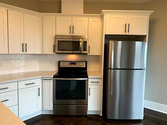 Stainless appliances in Kitchen include oven, microwave, refrigerator and dishwasher