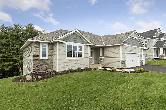 Custom built executive rambler situated on a private, wooded, walk-out lot.