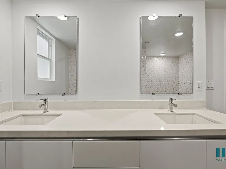 Bathroom with Double-Sink Vanity and Cabinet Storage