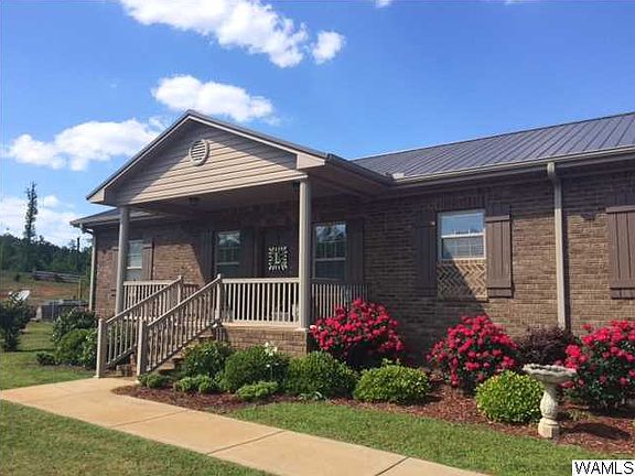 HOME IS VERY WELL LANDSCAPED WITH KNOCK OUT ROSES AND OTHER GREENERY