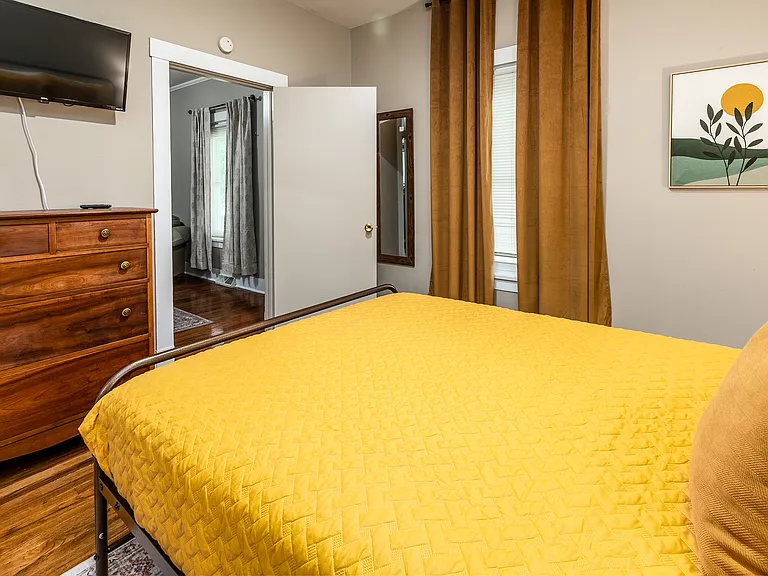 Queen bed with TV