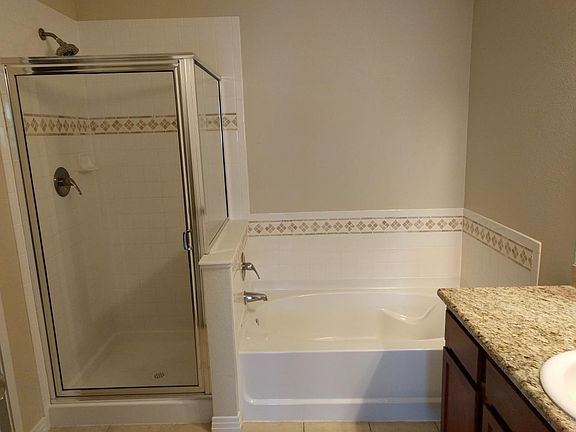 bathroom with shower and seperate tub