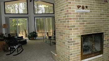 Open floor plan with two way gas fireplace.