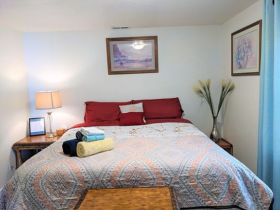 Another view of the room with King bed. In addition to a comforter with duvet, we also provide a king-size bed spreader for you to use.