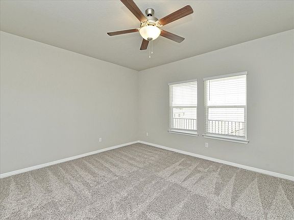 Relax at the end of the day in this spacious primary suite.