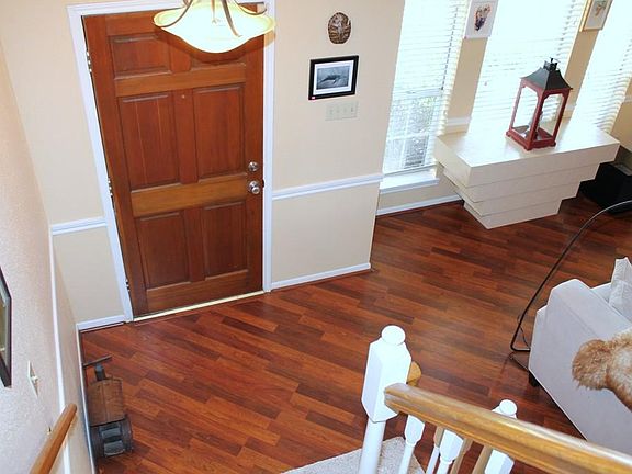 The pretty laminate wood floors start in the Entry and work their way into the Den.