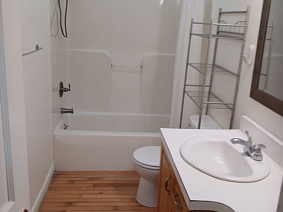 Bathroom has new shower with handle and combo tub and shower
