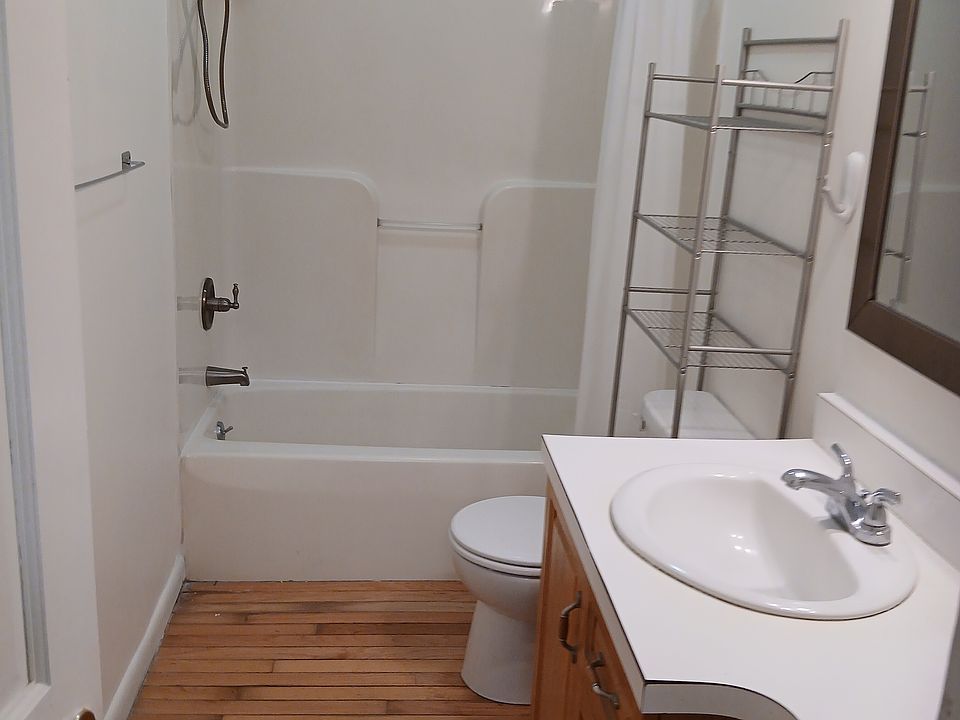 Bathroom has new shower with handle and combo tub and shower