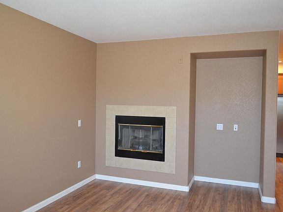 fireplace in living room with TV niche