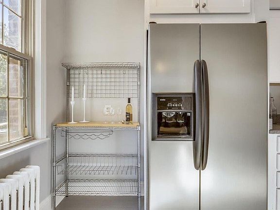 Sunny, spacious kitchen. Refrigerator has water and ice dispenser.