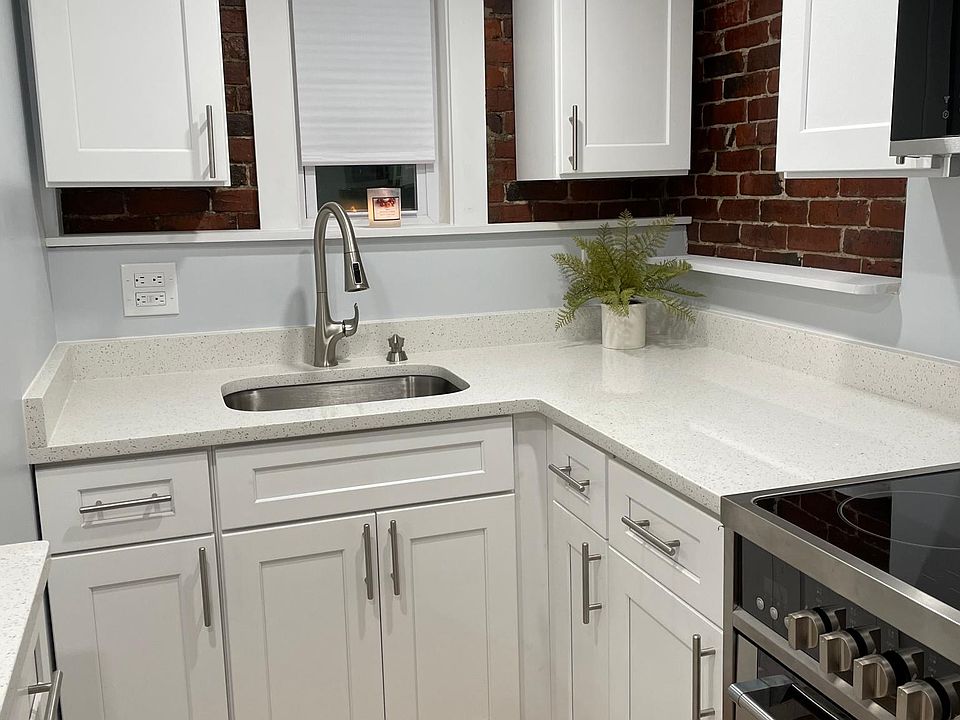 New kitchen with Shaker cabinets with cushion closers, new sink with delta faucet sprayer.