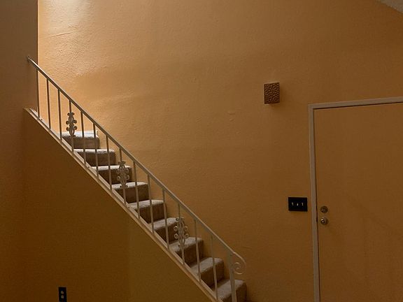 Ascend the stylish staircase to a private loft bedroom, an inviting retreat with ample natural light and an open, airy feel. Perfect for unwinding, this cozy space combines comfort and sophistication for a serene escape.