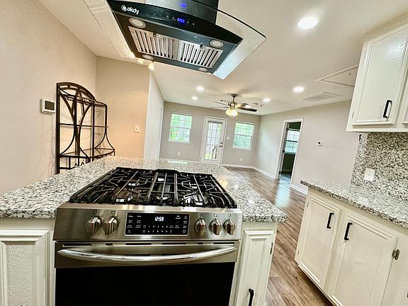 Kitchen with Island to Open Living Area