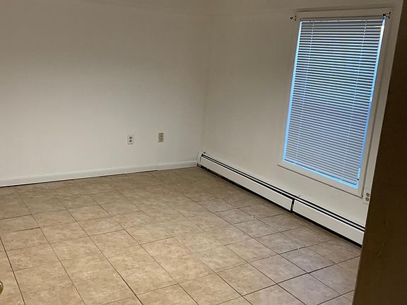 Larger bedroom. Sliding door closet not pictured to left.