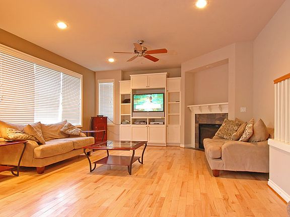 Main floor family room with built-in book cases and warm gas fireplace. Tall ceilings and very large