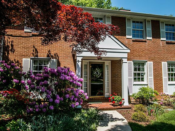 Beautiful landscaping frames the front walkway